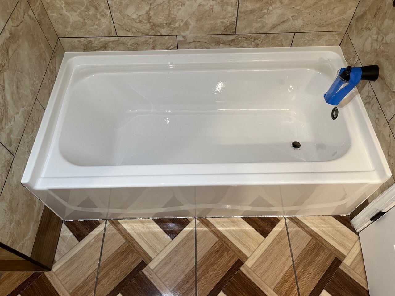 White bathtub with a freshly refinished smooth surface