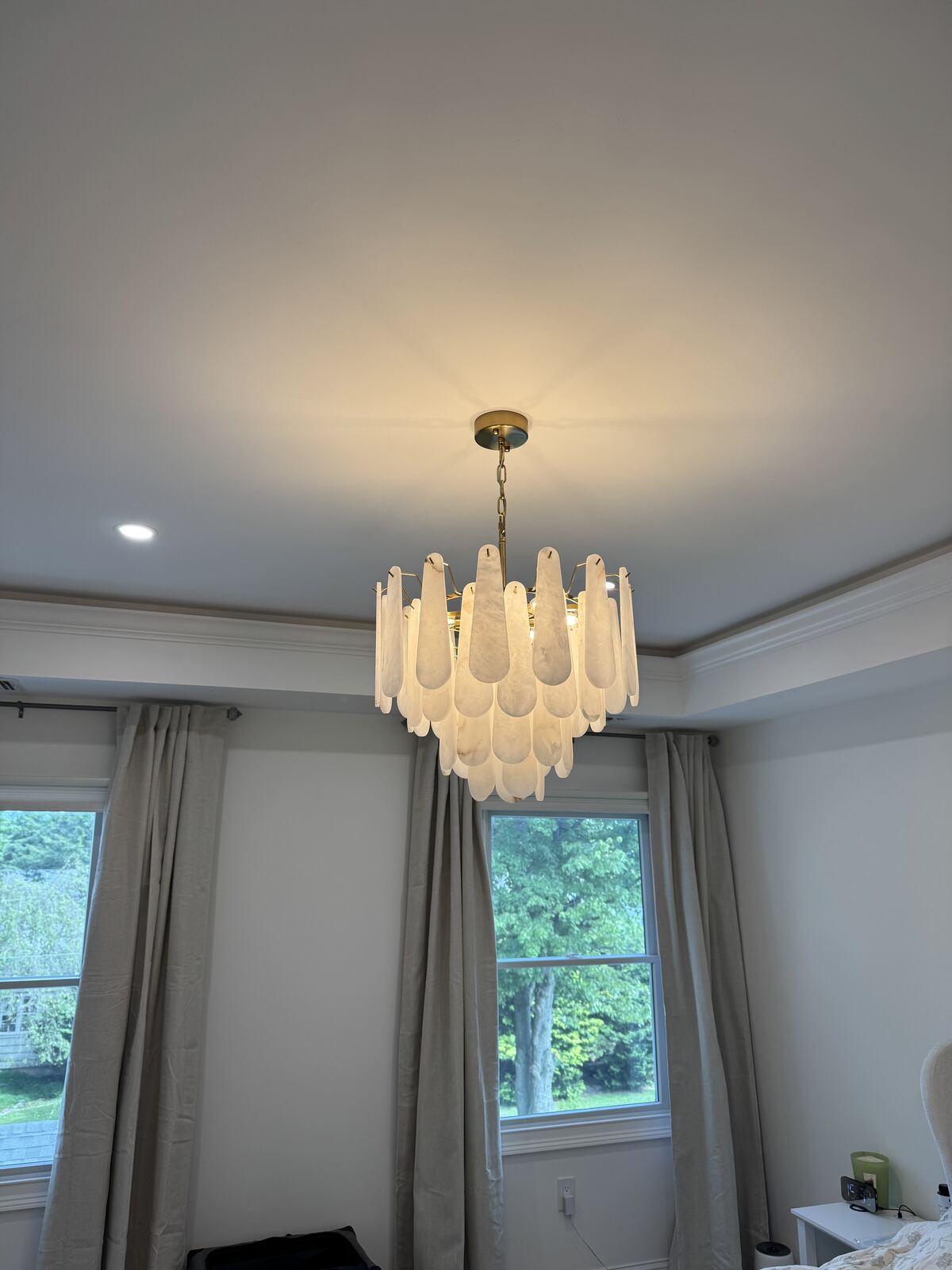 Chandelier mounted in a finished interior room
