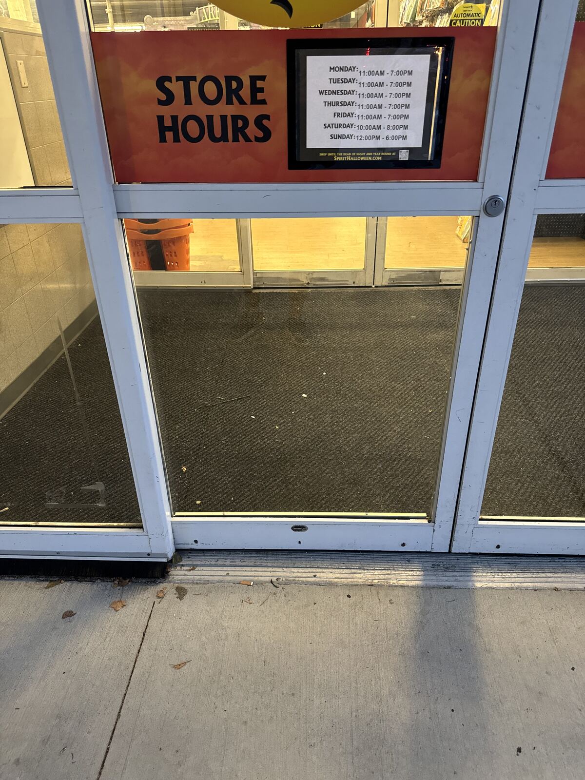 Commercial storefront entrance with a glass door and window