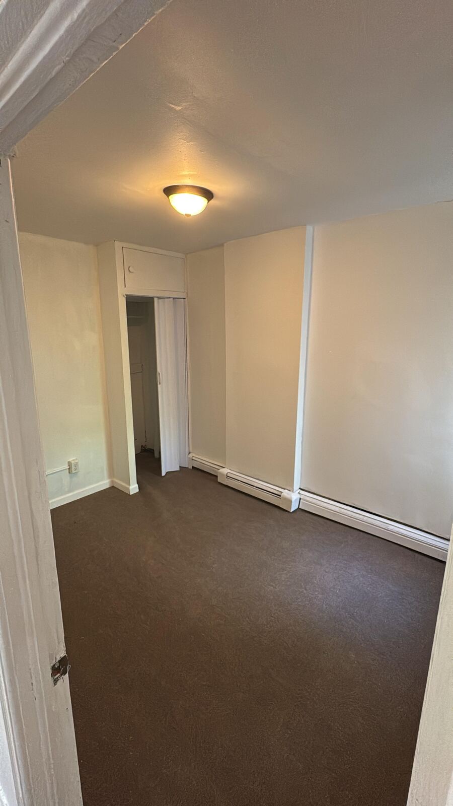 Cleared bedroom with light walls after a turnover